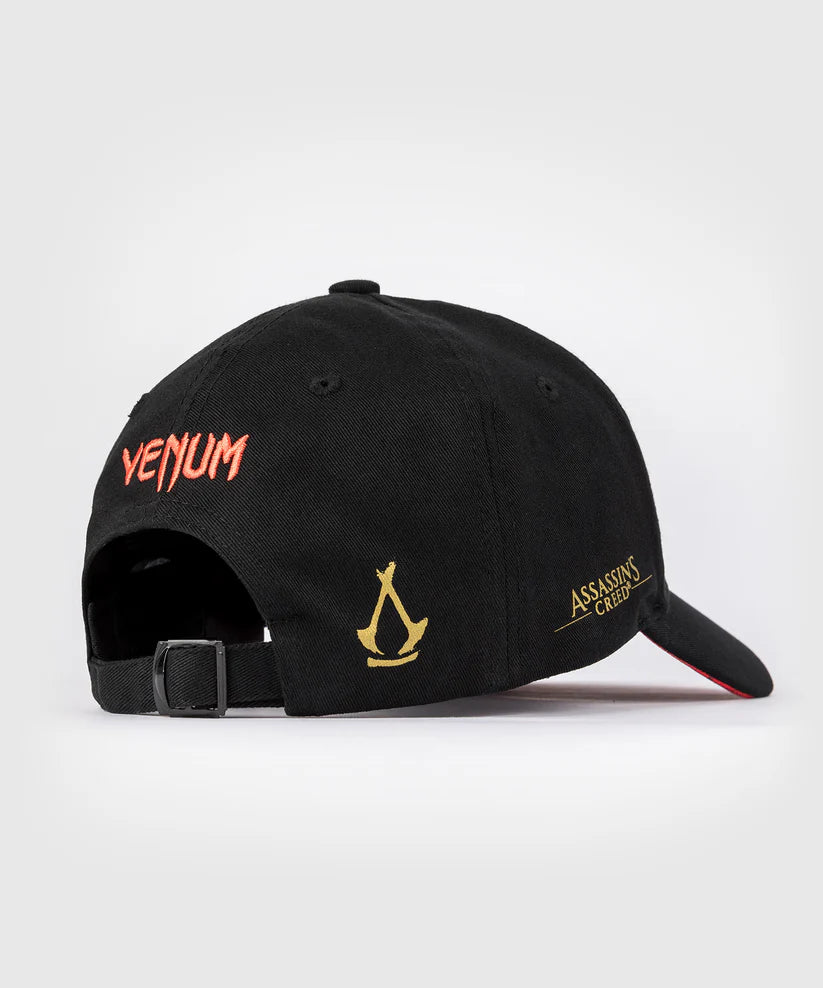 Gorra Venum x Assassin's Creed: Shadows (Negro / Dorado) (Disponible en Costa Rica y por Encargo)
