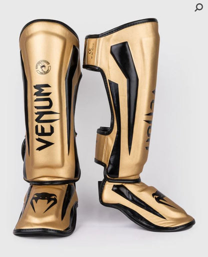 Espinilleras Venum Elite (Dorado / Negro) (Disponible por Encargo)