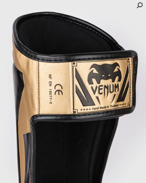 Espinilleras Venum Elite (Dorado / Negro) (Disponible por Encargo)