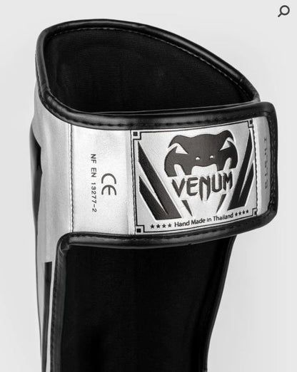 Espinilleras Venum Elite (Plateado / Negro) (Disponible por Encargo)