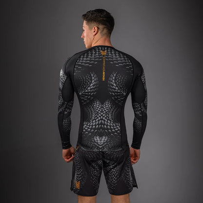 Rashguard Manga Larga Venum Matupa (Negro / Dorado) (Disponible en Costa Rica)